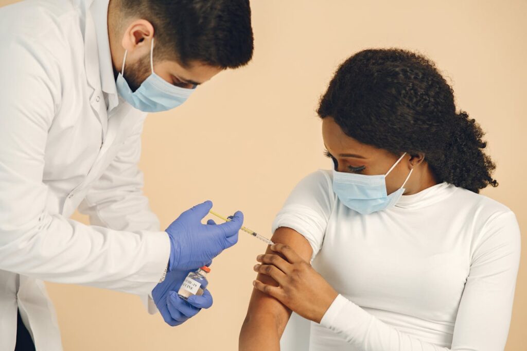 Women getting a vaccine