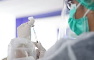 Clinician preparing a travel vaccine