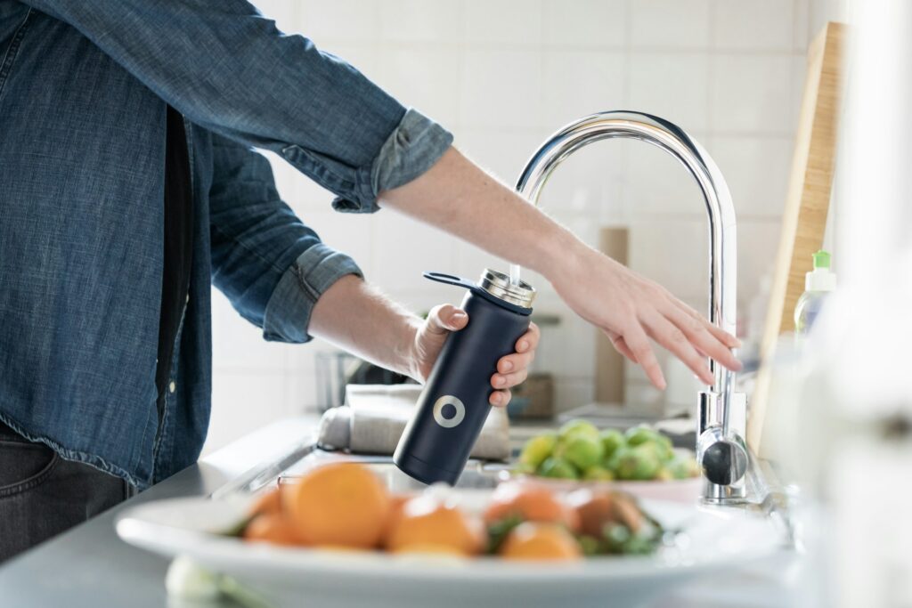 Filling a bottle to show safe drinking habits